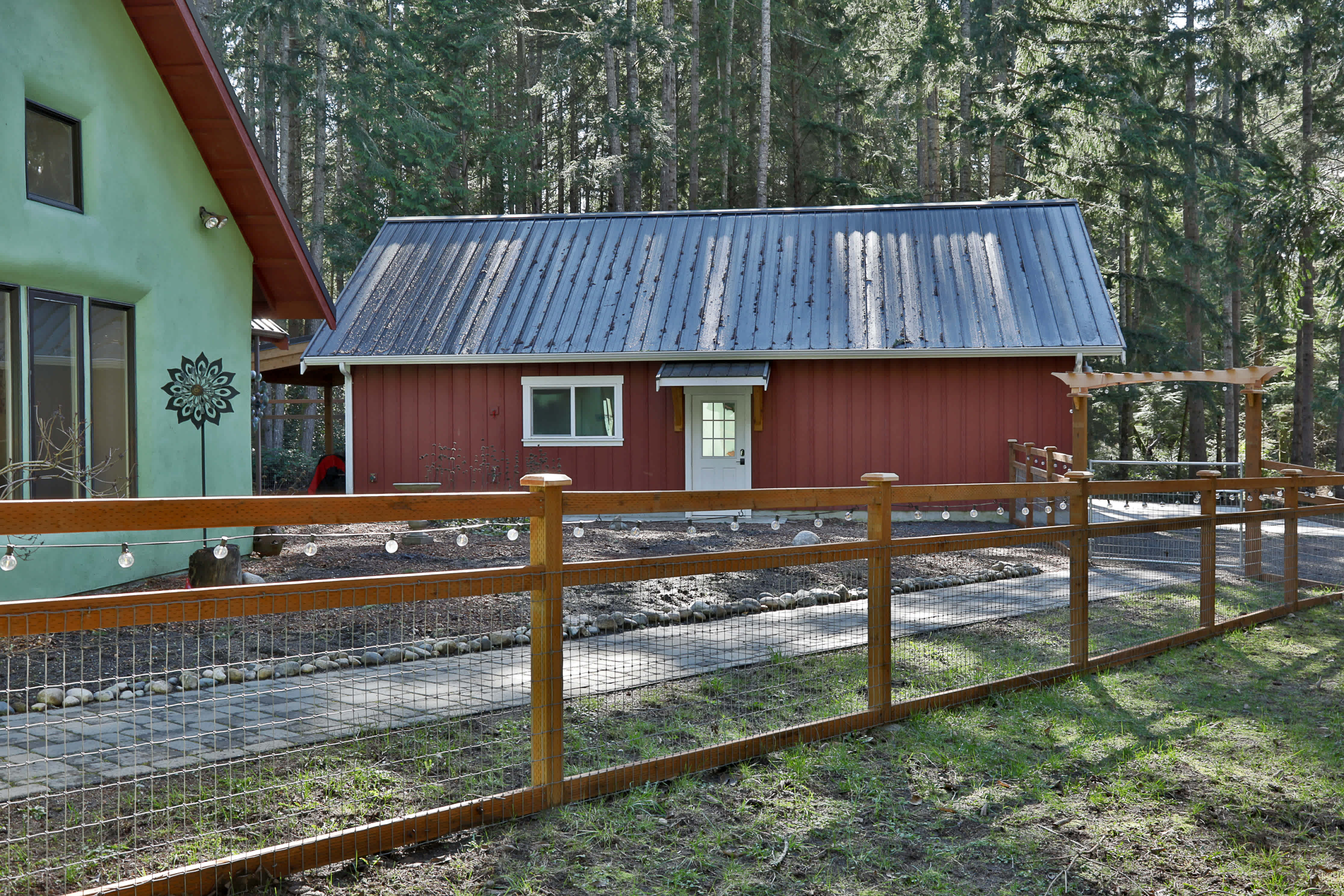 Detached 2 car garage with 400sf shop, .5 bath, & Laundry.