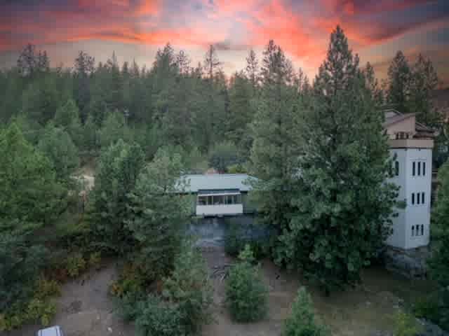 Welcome to coveted Liberty Lake, Washington! Eco-friendly home nestled on a private treed lot!